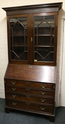 Lot 466 - A Georgian mahogany bureau bookcase, the upper...