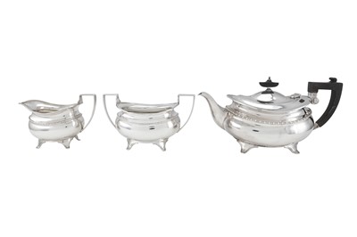 Lot 208 - A George V sterling silver three-piece tea...