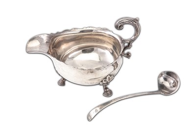 Lot 331 - A George V sterling silver sauce boat,...
