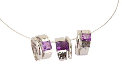 Lot 306 - An amethyst pendant necklace and earring suite,...
