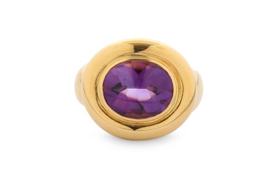 Lot 353 - An amethyst dress ring, the oval cabochon...