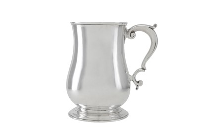 Lot 226 - A George II sterling silver mug, London 1749...