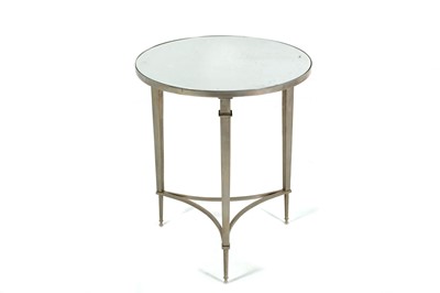 Lot 671 - A modern silvered circular side table with...