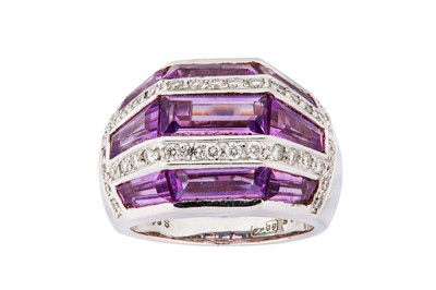 Lot 79 - A diamond and amethyst dress ring Of...