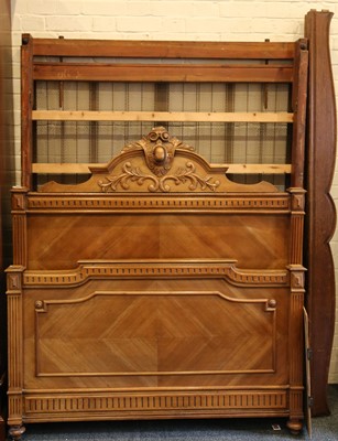 Lot 281 - A French oak double bed with carved head and...