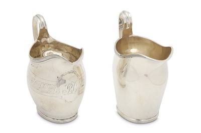 Lot 328 - Two sterling silver silver cream jugs, one...