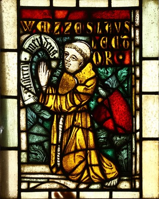 Lot 745 - A stained glass panel of a praying Franciscan...