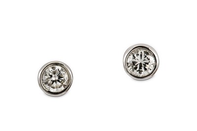 Lot 153 - A pair of diamond earstuds Each collet-set...