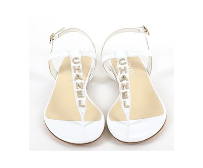 Lot 301 - Chanel White Patent Sandals, c. 2018, gilt and...