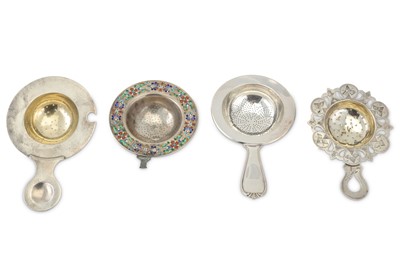 Lot 357 - A mixed group of three tea strainers,...
