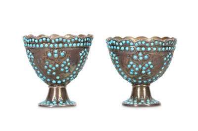 Lot 278 - A PAIR OF TURQUOISE-ENCRUSTED SILVER ZARFS...