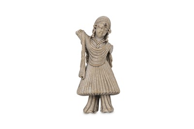 Lot 300 - A CARVED SOAPSTONE FEMALE FIGURINE India, 18th...