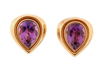 Lot 69 - A pair of amethyst earclips Each collet-set...