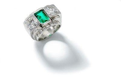 Lot 187 - An emerald and diamond dress ring, circa 1935...