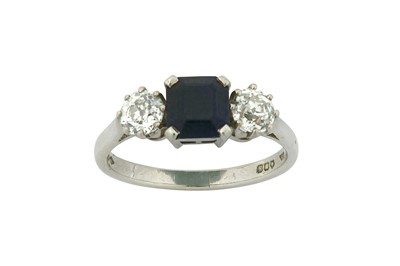 Lot 23 - A sapphire and diamond three-stone ring The...