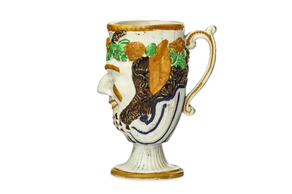 Lot 108 - A PRATTWARE 'BACCHUS' FROG MUG, early 19th...