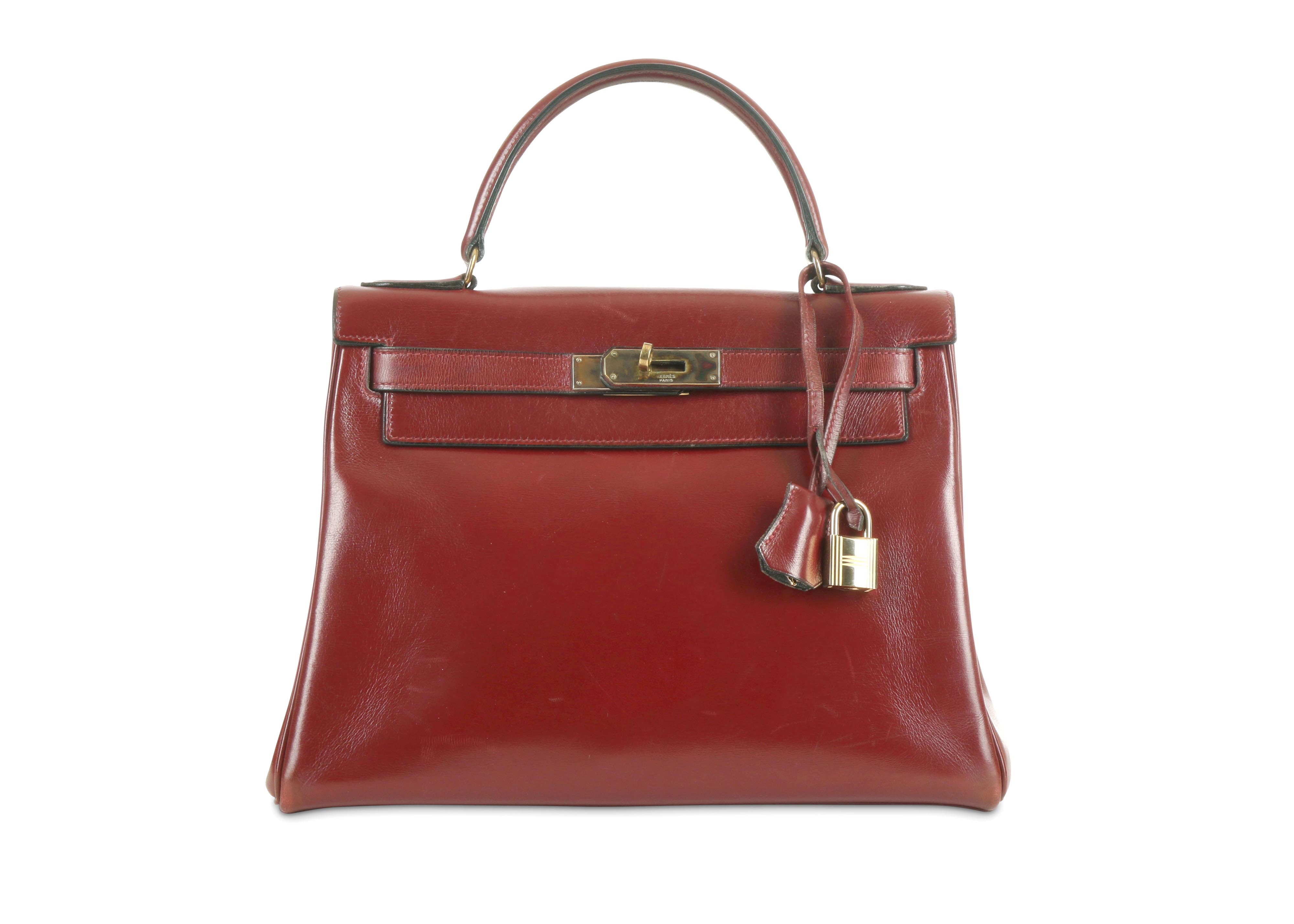 Lot 379 - Hermes Rouge H Kelly Retourne 28, c. 1970