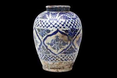 Lot 230 - A QAJAR BLUE AND WHITE POTTERY JAR  Iran, late...