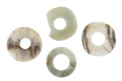 Lot 260 - FOUR CHINESE JADE BI DISCS. Comprising two...