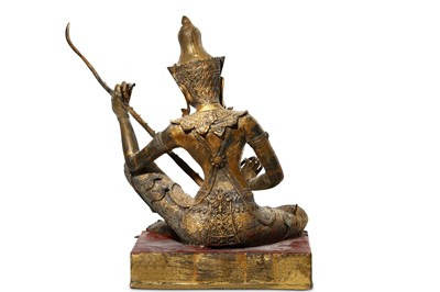 Lot 378 - A THAI GILT METAL FIGURE OF A FEMALE MUSICIAN....