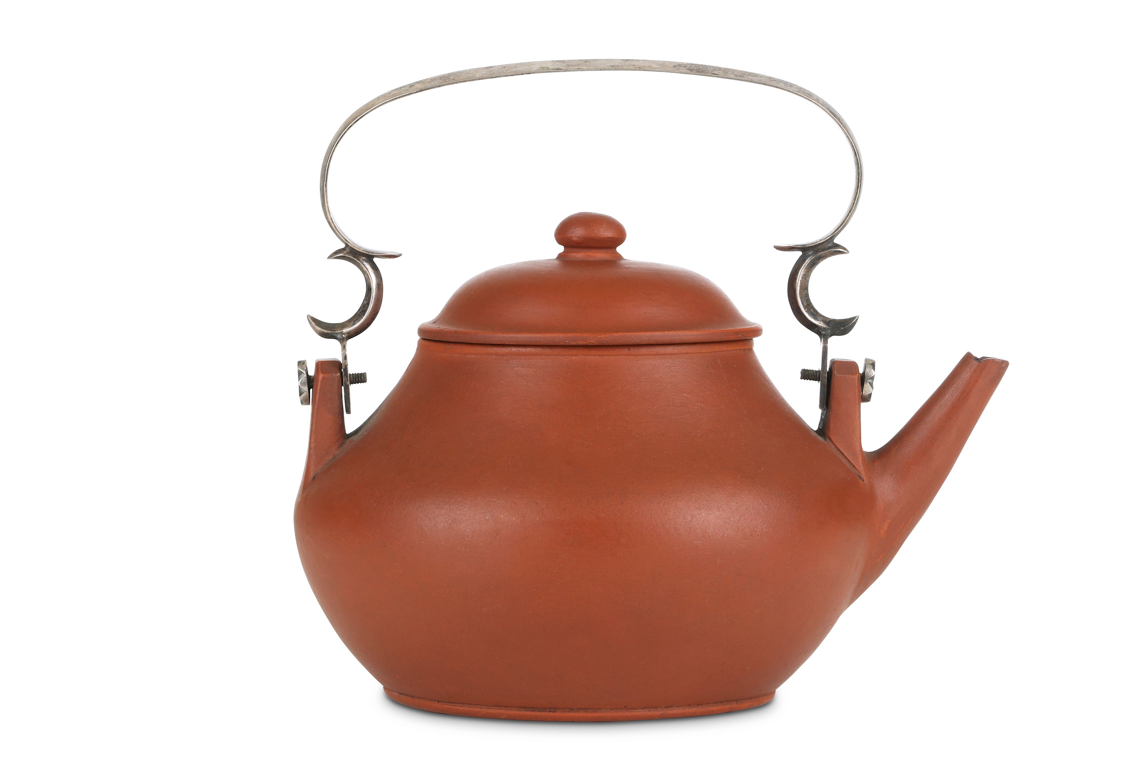 Lot 324 A CHINESE SILVERHANDLED YIXING ZISHA TEAPOT