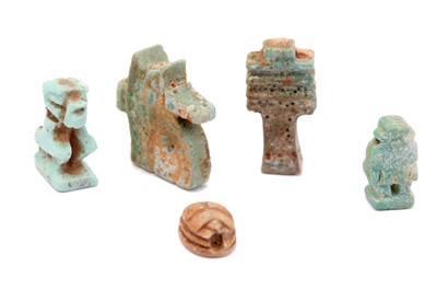 Lot 17 - A GROUP OF EGYPTIAN GLAZED COMPOSITION AMULETS...