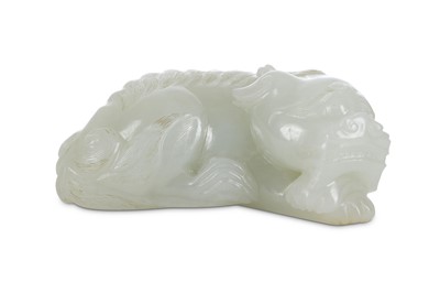 Lot 345 - A CHINESE PALE CELADON JADE 'QILIN' CARVING....