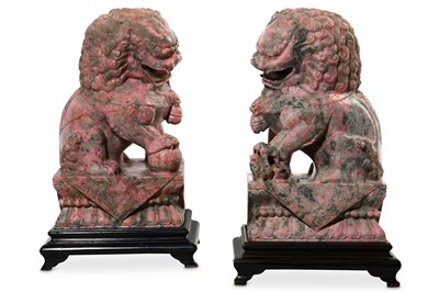 Lot 53 - A PAIR OF PINK JADE BUDDHIST LION DOGS. 20th...
