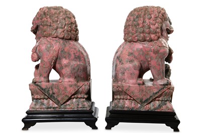 Lot 53 - A PAIR OF PINK JADE BUDDHIST LION DOGS. 20th...