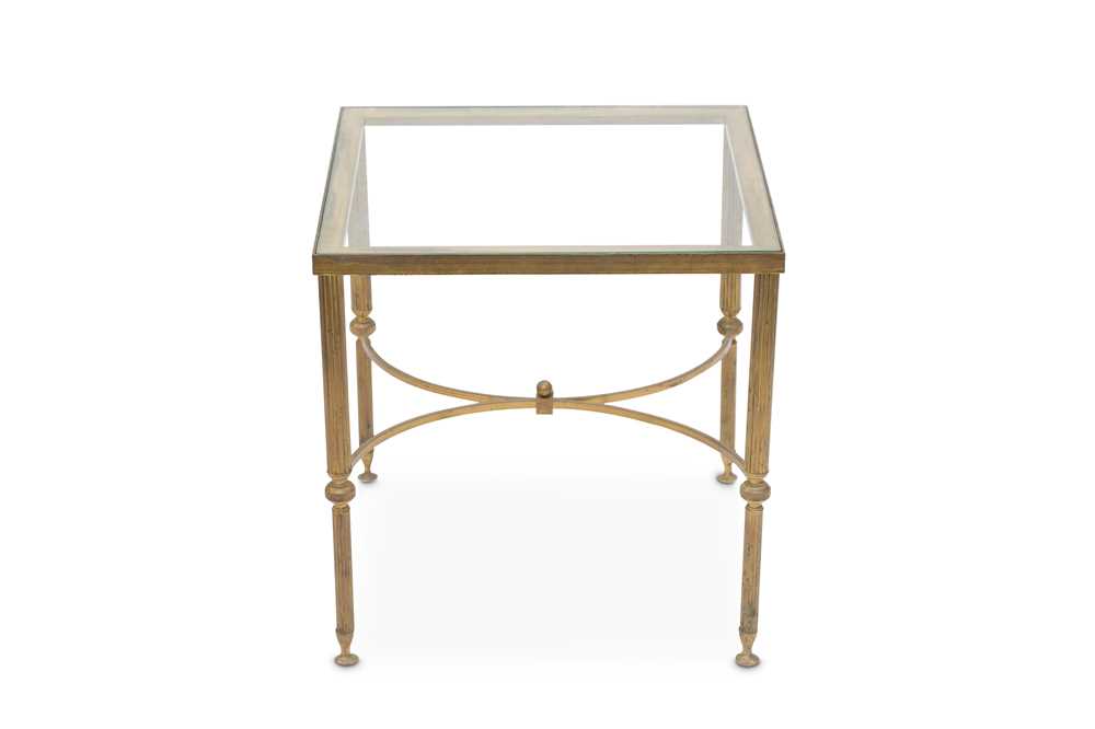 Lot 693 - A French Empire style brass side table with...