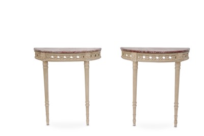 Lot 697 - A pair of French cream painted demi lune...