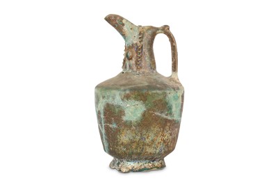 Lot 24 - A KASHAN TURQUOISE-GLAZED POTTERY EWER Iran,...