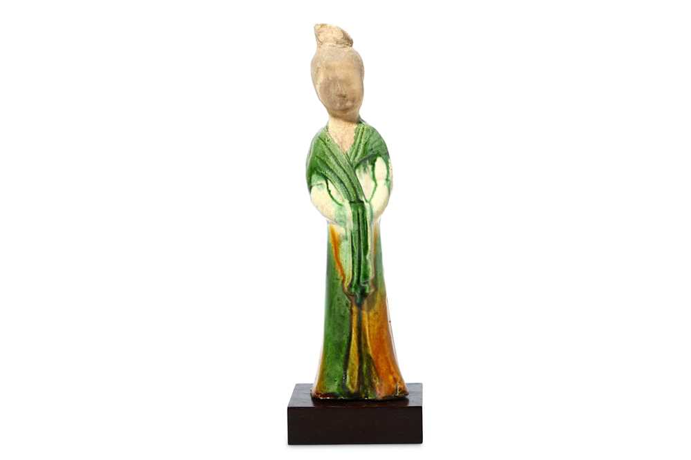 Lot 78 - A CHINESE SANCAI-GLAZED POTTERY FIGURE OF A...