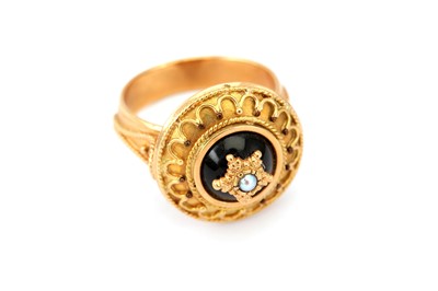 Lot 403 - An archaeological revival ring, with bead and...