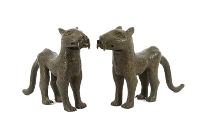 Lot 857 - A pair of African cast bronze lionesses in...