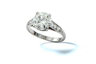 Lot 113 - A diamond single-stone ring The claw-set...