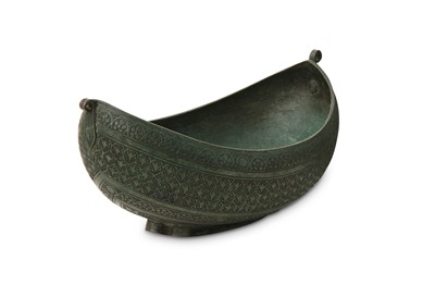 Lot 557 - An incised bronze kashkul (beggar's bowl)...