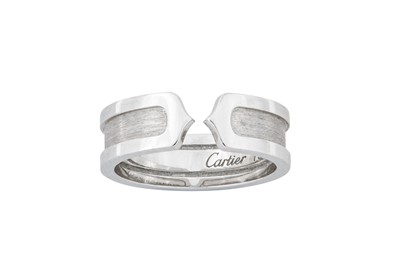 Lot 15 - A 'Logo' ring, by Cartier  The split opening...