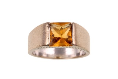 Lot 81 - A citrine 'Torc' ring, by Cartier Centrally...