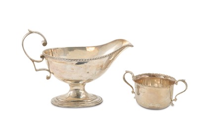 Lot 304 - An American sterling silver sauce boat, with a...