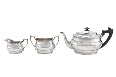 Lot 207 - A George V sterling silver three-piece tea...