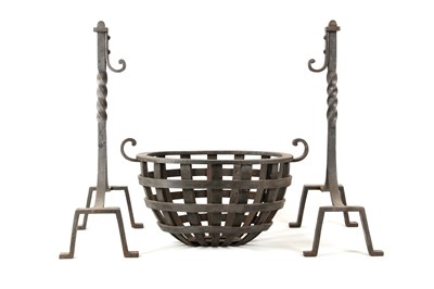 Lot 628 - An oval wrought iron fire basket, together...