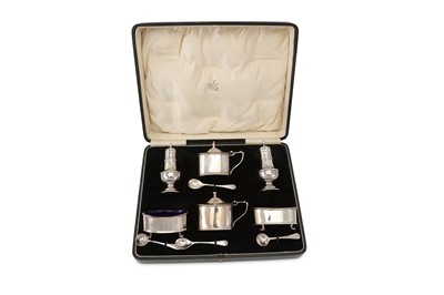 Lot 301 - Two cased sterling silver cruet sets, the...