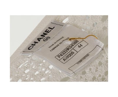 Lot 298 - Chanel White Crochet Cardigan, silver metal CC...
