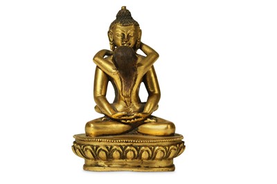 Lot 375 - A SINO-TIBETAN GILT-BRONZE FIGURE OF...