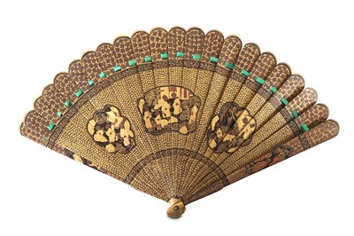 Lot 73 - A CHINESE GILT-DECORATED BLACK LACQUER FAN....