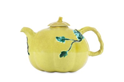 Lot 323 - A CHINESE YELLOW-GLAZED TEAPOT AND COVER. Qing...