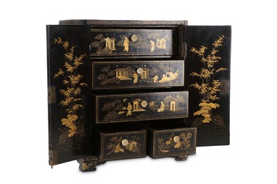 Lot 74 - A CHINESE GILT-DECORATED BLACK LACQUER CABINET....