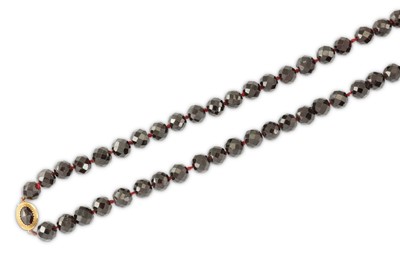 Lot 68 - A garnet bead necklace The series of faceted...