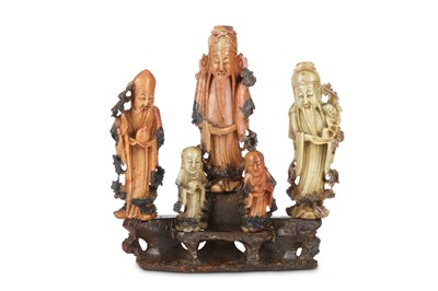Lot 266 - A CHINESE SOAPSTONE CARVING OF IMMORTALS. Late...